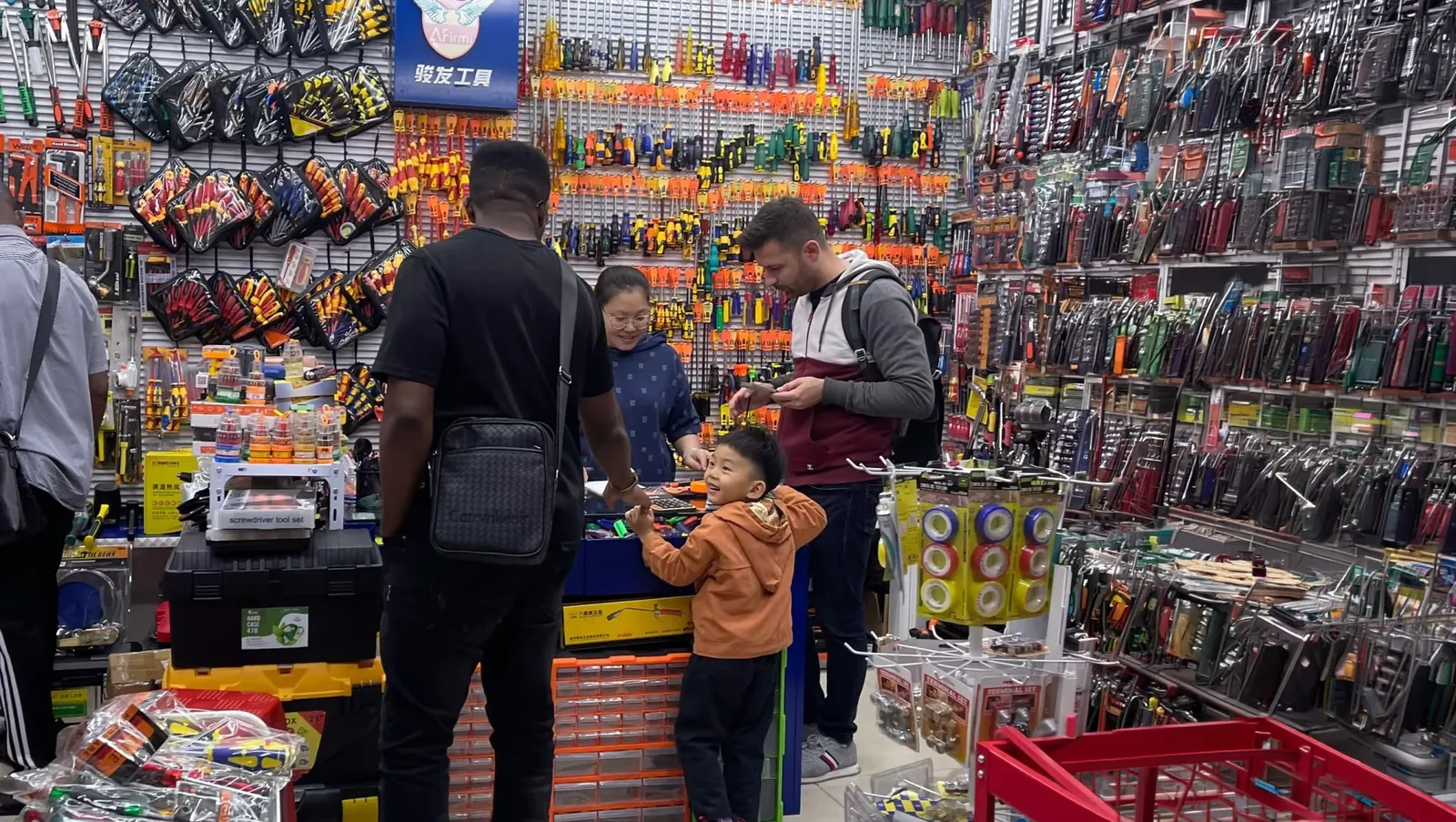 Buyers reviewing products and prices in a wholesale market