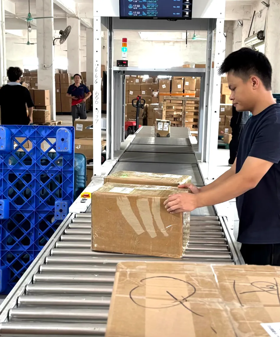 Packed cartons moving through a quality control line