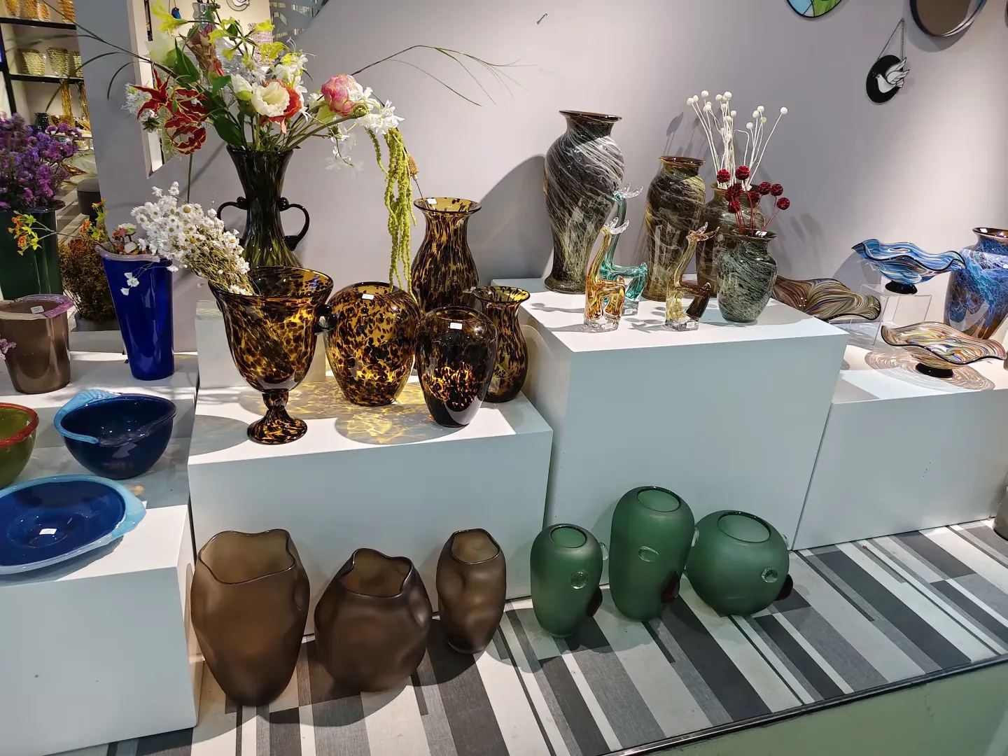 Glassware product samples displayed for review