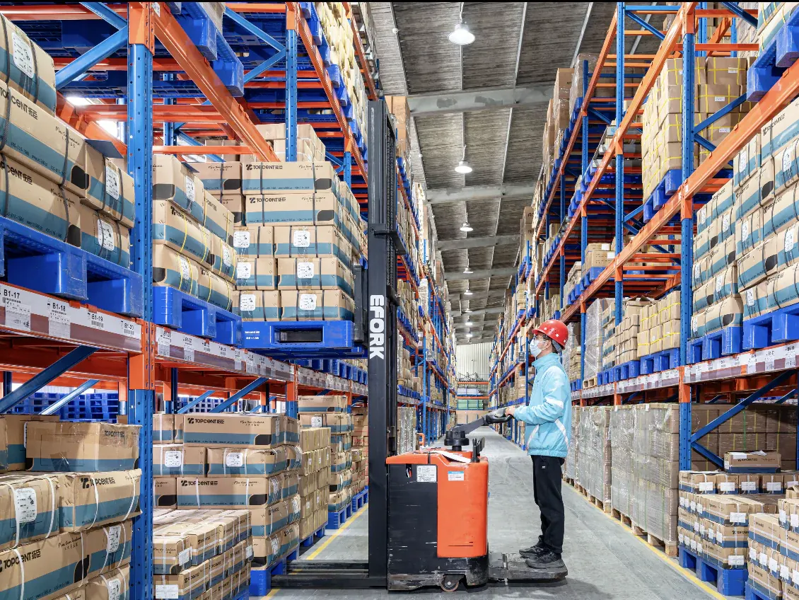 Warehouse worker inspecting products before shipment